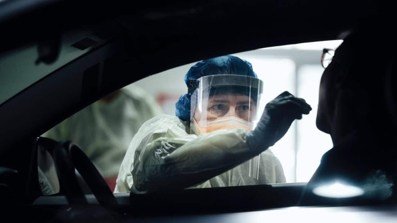 A nurse tests a patient at a COVID-19 testing site in ACT over the weekend.