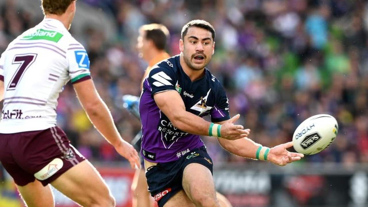 Storm's Jahrome Hughes passes the ball during a game in Melbourne.