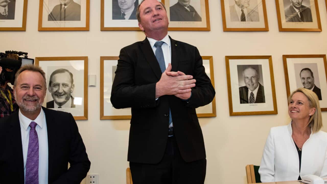 Nationals Leader Barnaby Joyce (C) during a party meeting