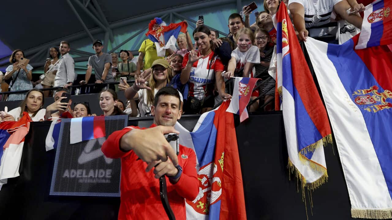 Serbia's Novak Djokovic takes a selfie with fans after winning the Adelaide International finals against USA's Sebastian Korda