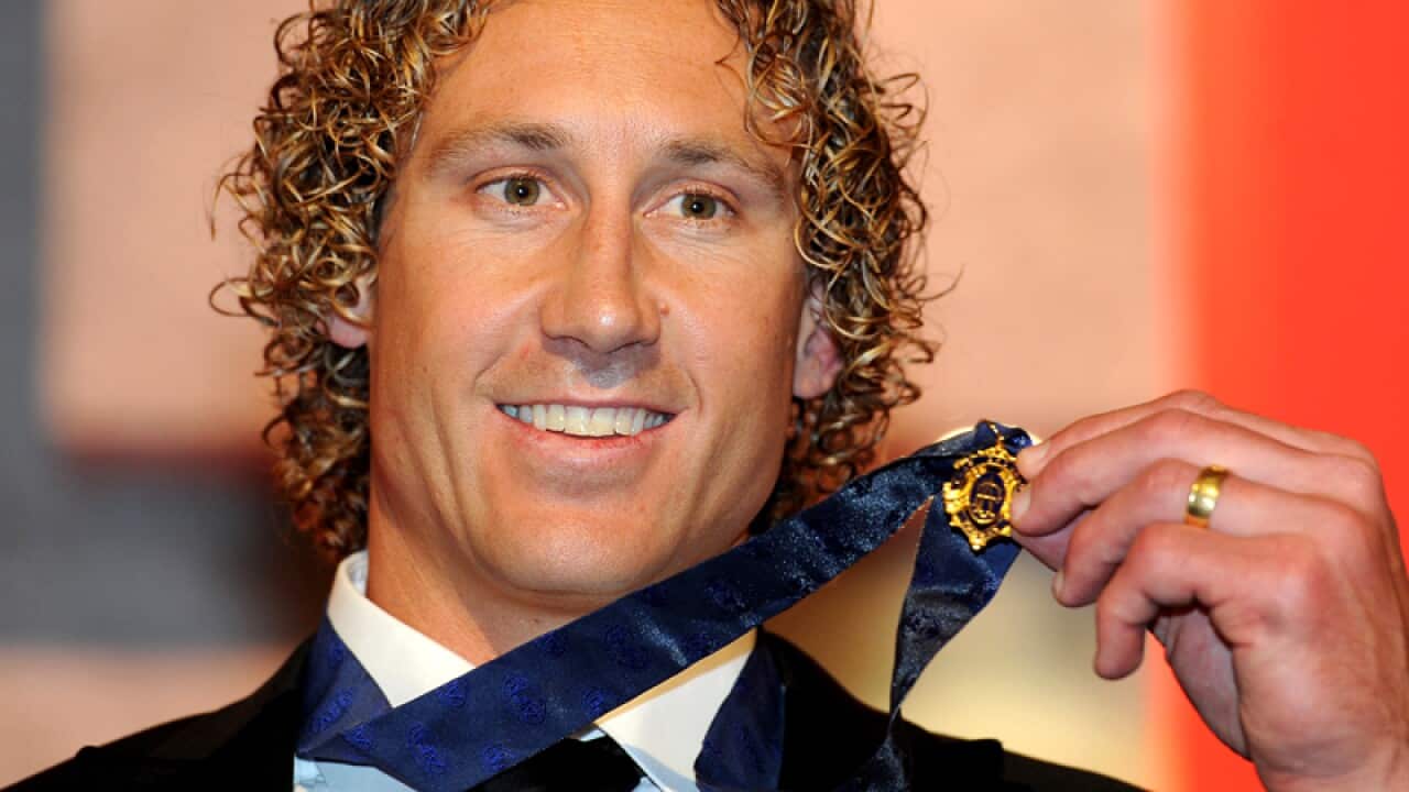Matt Priddis of the West Coast Eagles holds his Brownlow Medal