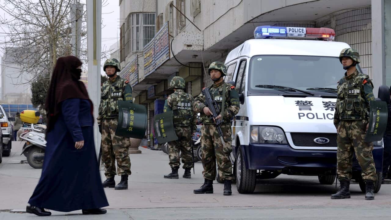 Chinese paramilitary policemen stand guard