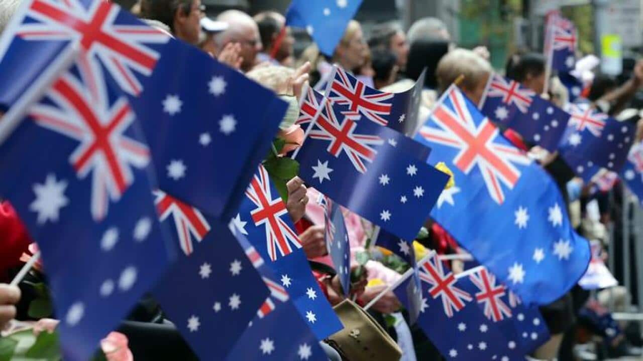 Australian flags waving as country continues to debate whether the date needs to be changed