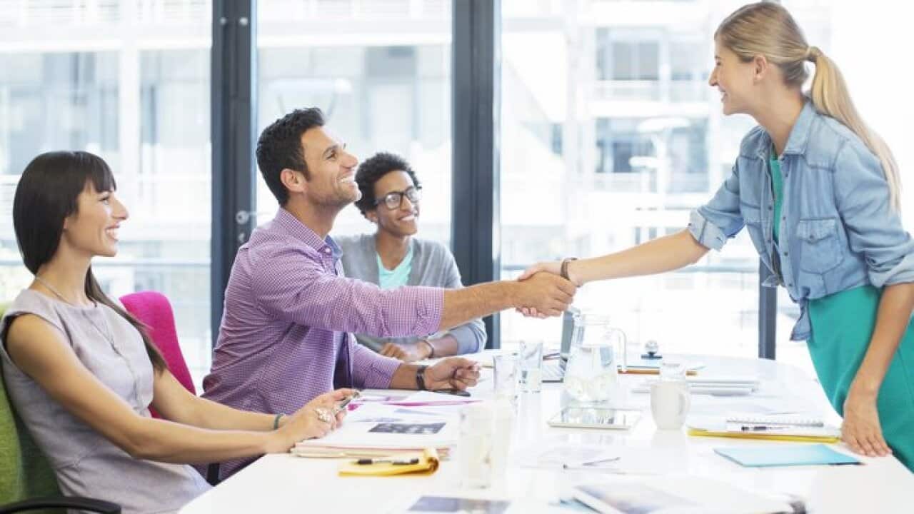 Business people shaking hands in meeting