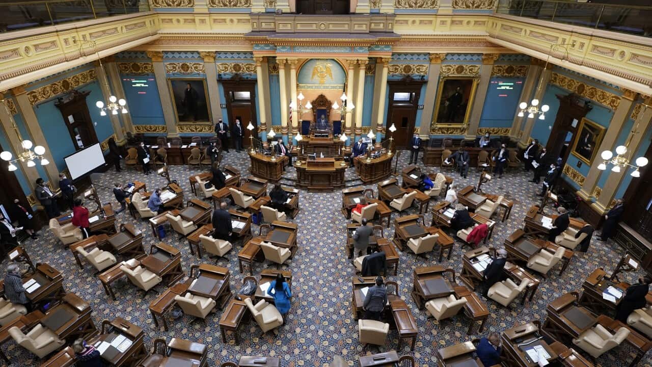 Michigan Lt. Gov. Garlin Gilchrist opens the state's Electoral College session at the state Capitol