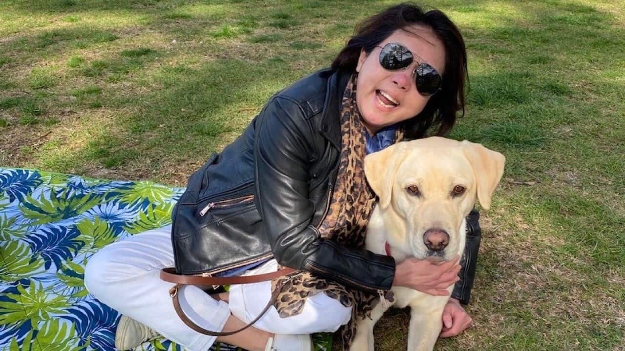 Tracy Wang with her guide dog