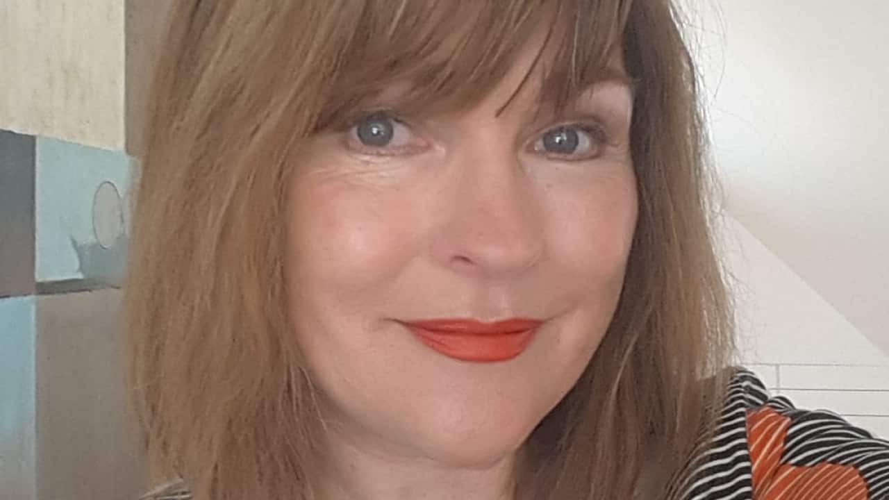 A woman takes a selfie