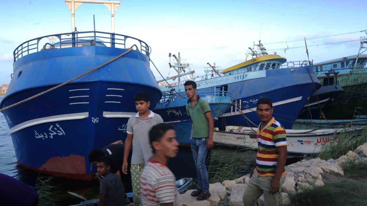 Relatives of missing persons on the capsized boat gather as they wait for rescue workers, the port city of Rosetta, some 250km north of Cairo, Egypt