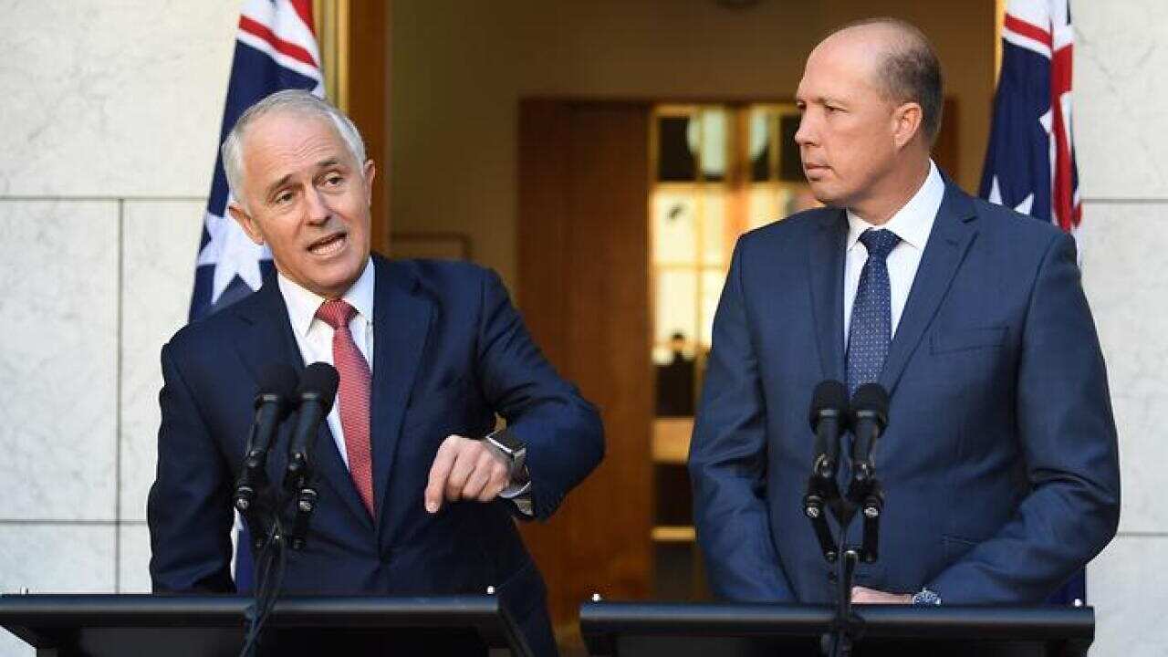 Australian Prime Minister Malcolm Turnbull (left) and Minister for Immigration and Border Protection Peter Dutton speak during a press conference