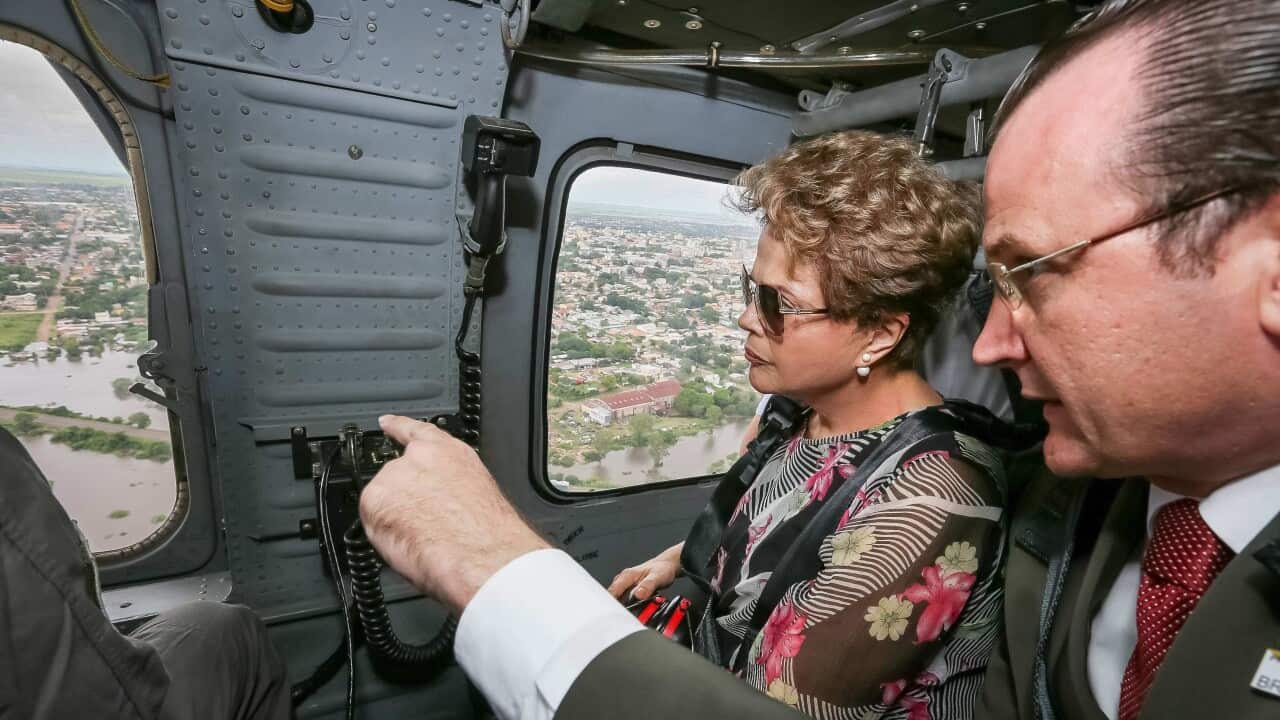 Handout picture by Presidency of Brazil that shows the President of Brazil, Dilma Rousseff (2R) in a flyover the flooded areas at the south of Brazil, 26 December 2015. (EPA)