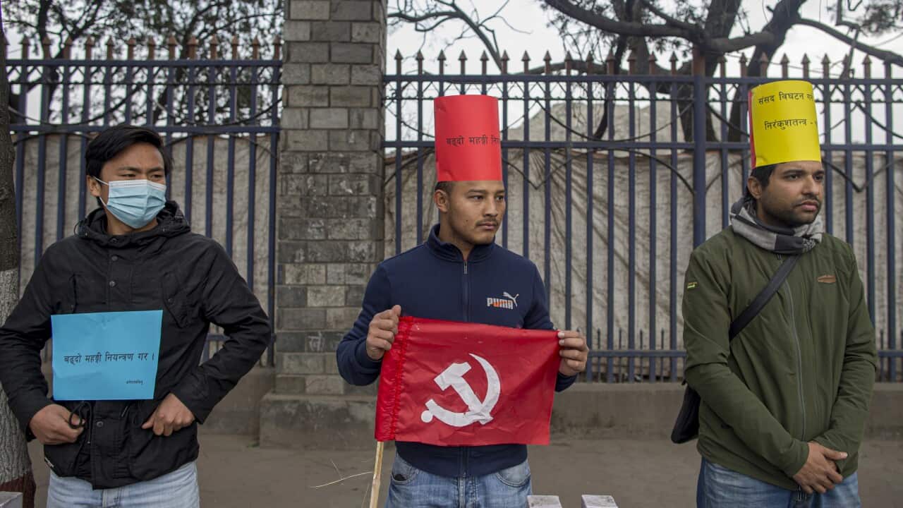 Activists of the Nepalese Communist party attend a mass human chain protest against Prime Minister Oli in Kathmandu, Nepal, 18 February 2021.