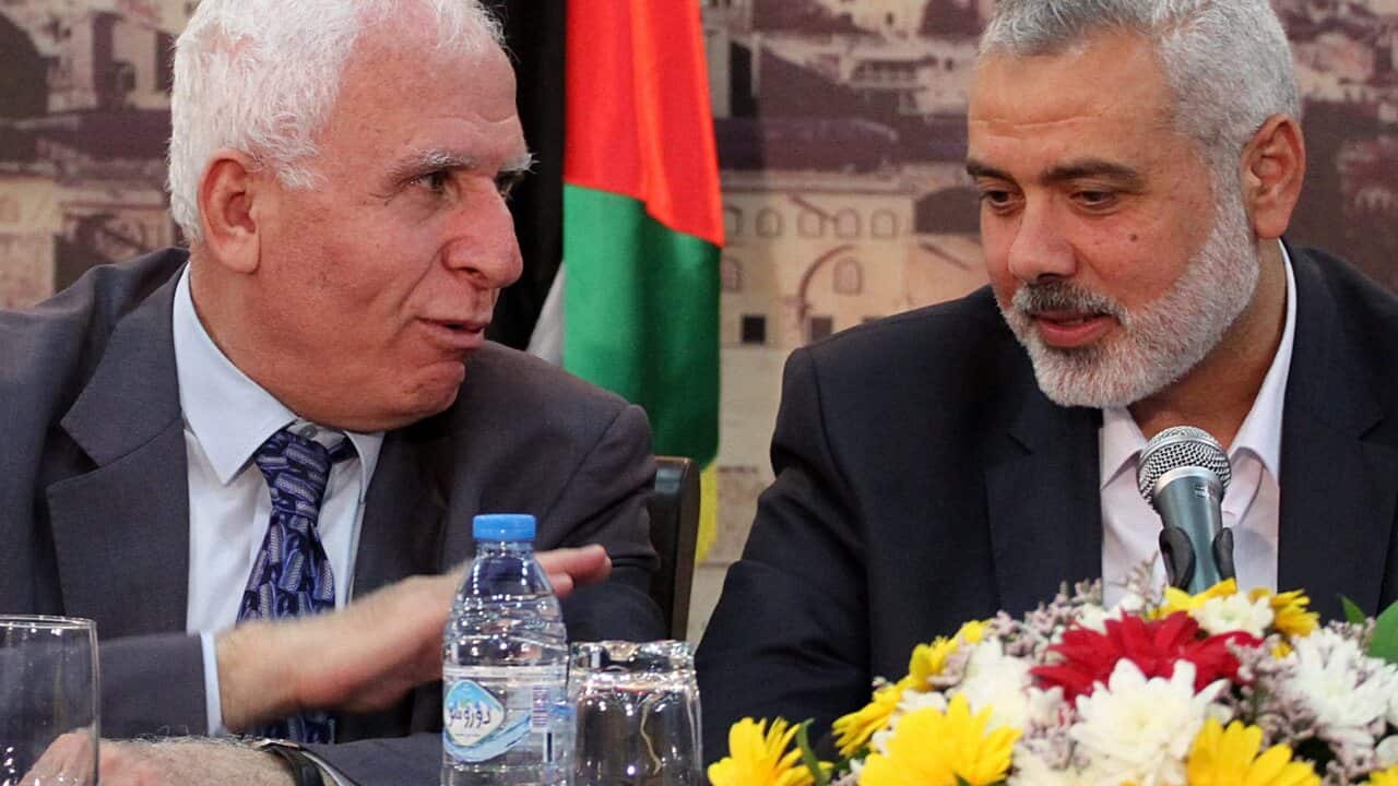 Hamas Prime Minister Ismael Haneiya, right, and Fatah's Azzam Al Ahmad (AAP).jpg