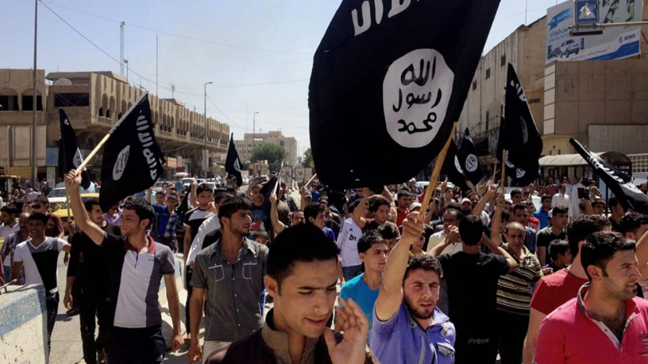 Demonstrators chant pro-Islamic State group slogans.