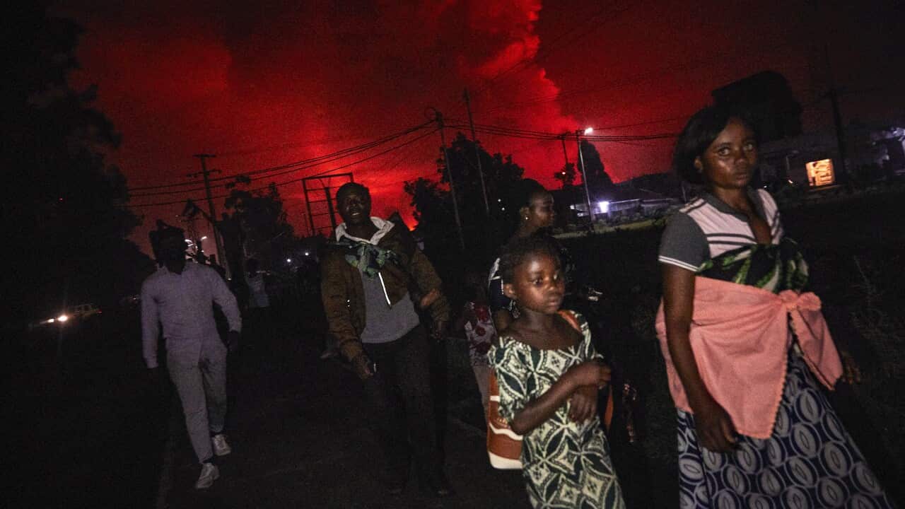 Residents flee from Mount Nyiragongo volcano as it erupts over Goma, Democratic Republic of the Congo, 22 May 2021.