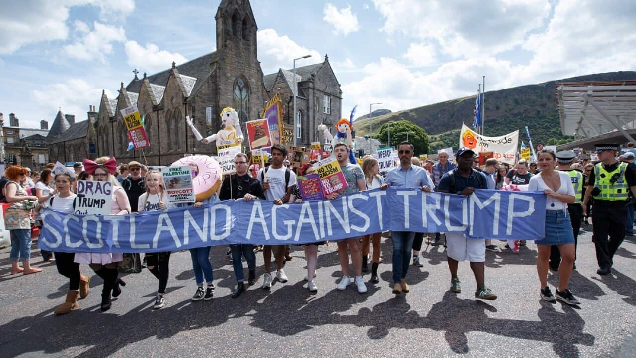 People join an anti-Trump protest march in Edinburgh.