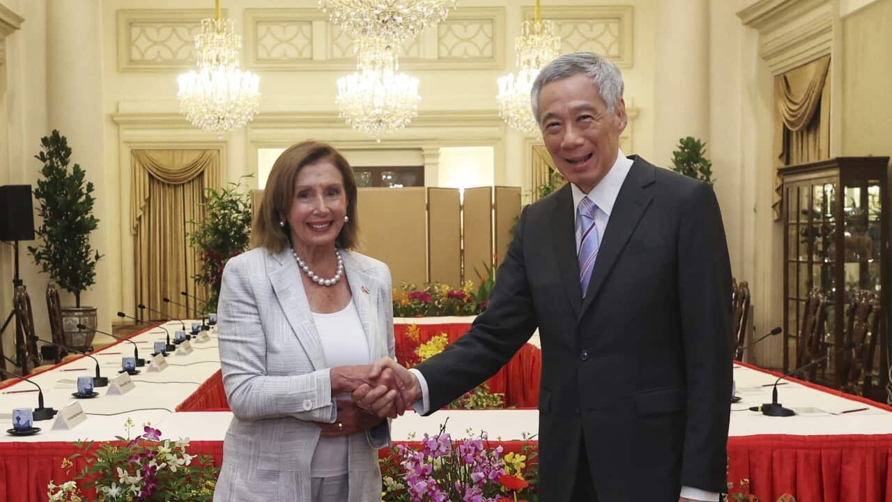 U.S. House Speaker Nancy Pelosi, left, and Prime Minister Lee Hsien Loong shake hands in Singapore at the start of her Asian tour