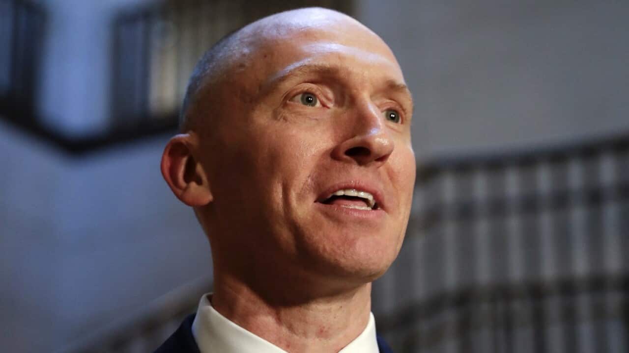 Carter Page speaks to reporters in 2017.