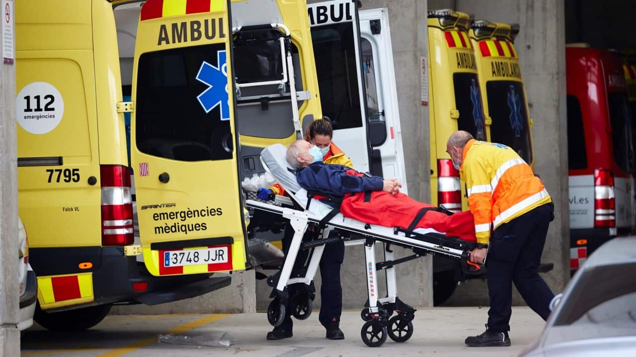 Paramedics transfer a patient to the ER ward of a hospital in Barcelona, Spain