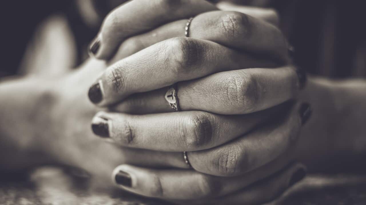 Close-Up Of Clasped Hands