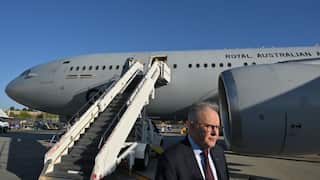 Anthony Albanese in front of a plane