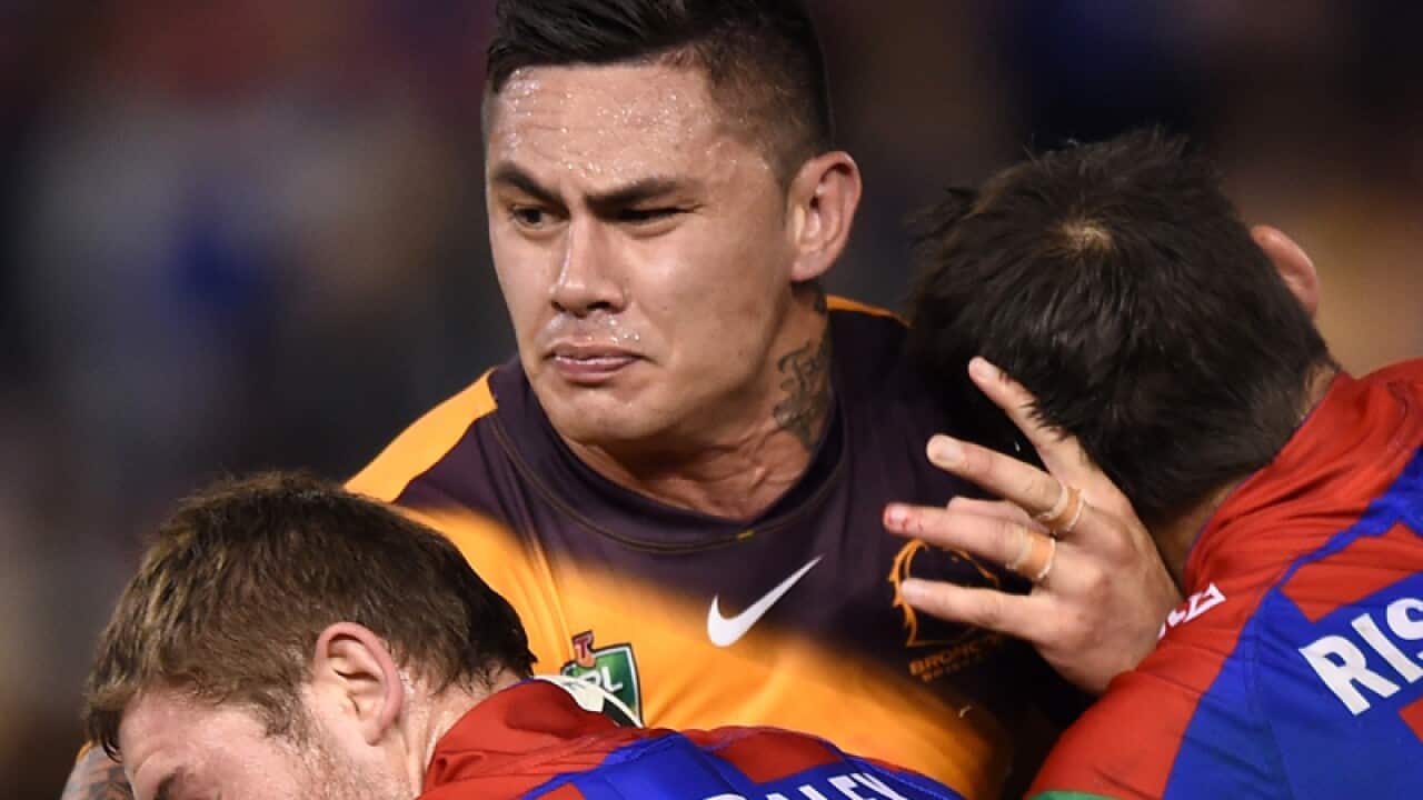 Daniel Vidot (centre) of the Broncos