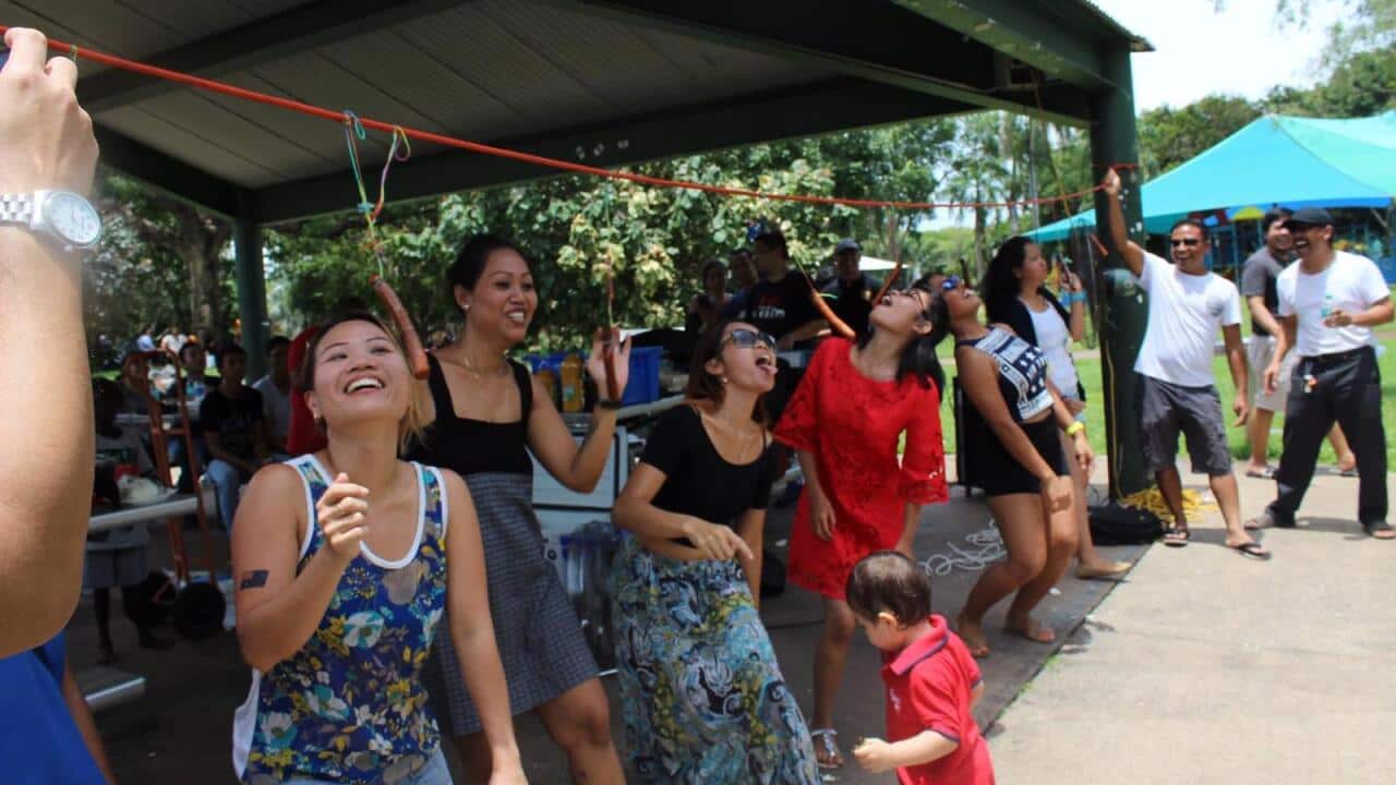 Indonesian Community in Darwin at Sausage eating competition to celebrate Australia Day.