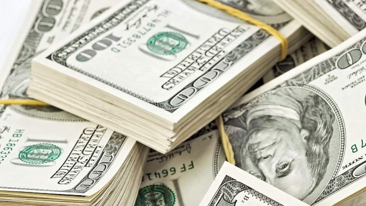 Many bundle of US 100 dollars bank notes