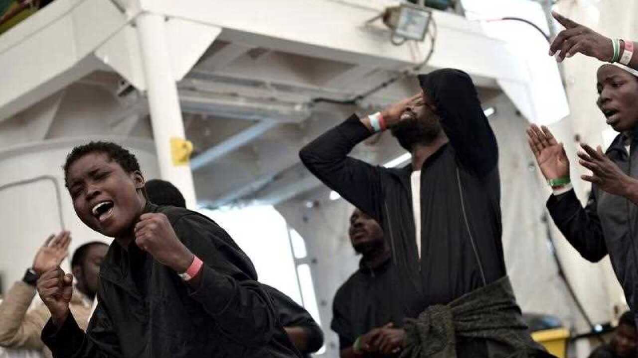Migrants rejoicing in their last moments on board the 'Aquarius' rescue vessel before disembarking in Valencia, Spain, 17 June.