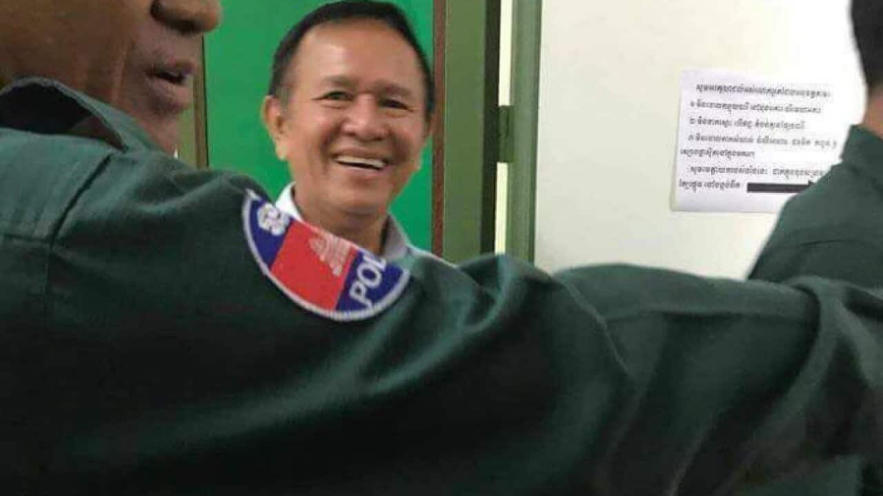 Kem Sokha escorted by police