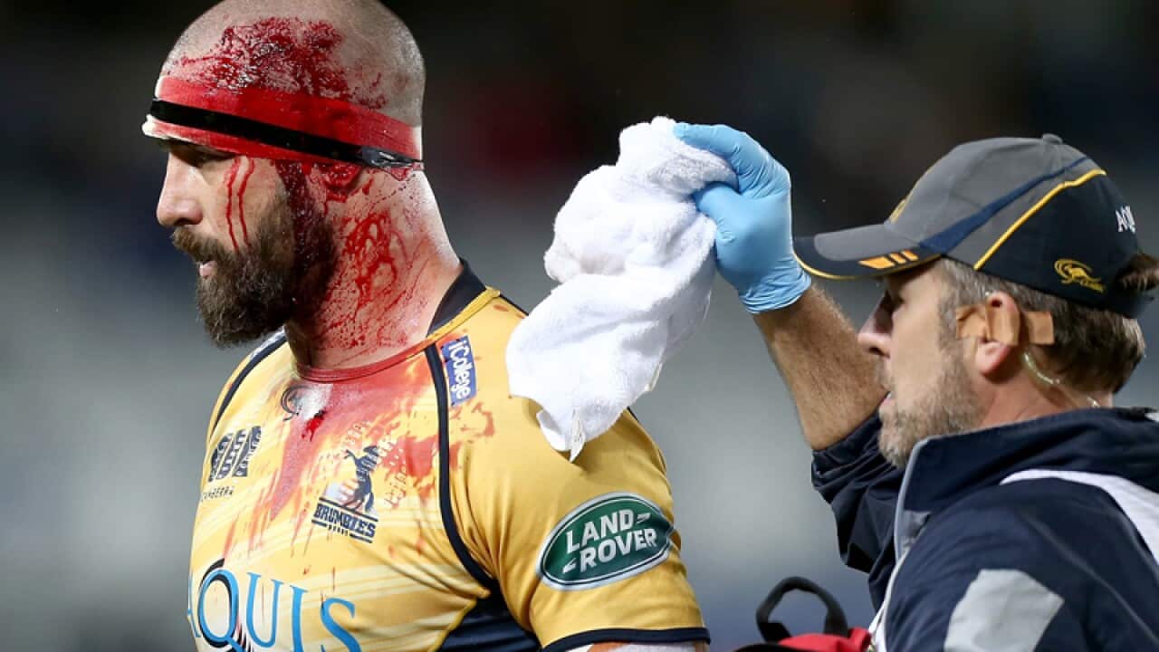 Scott Fardy of the Brumbies receives attention