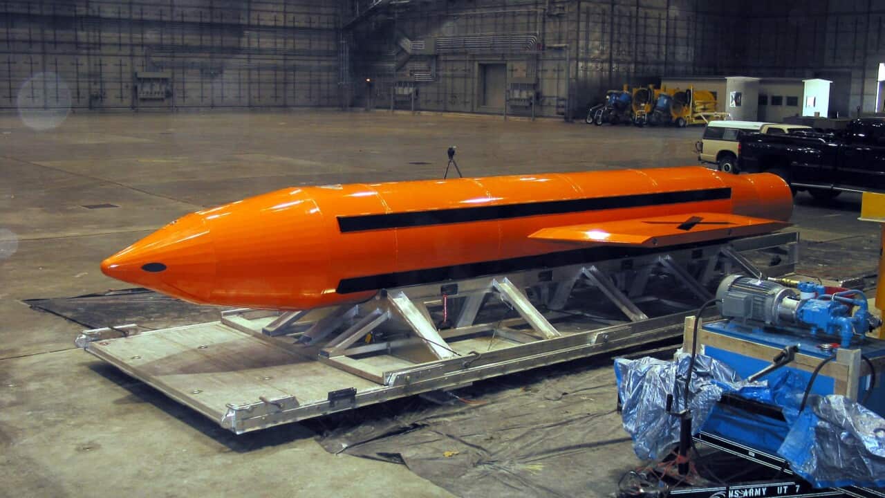 a GBU-43 Massive Ordnance Air Blast (MOAB) bomb being prepared for testing at the Eglin Air Force Armament Center, Florida