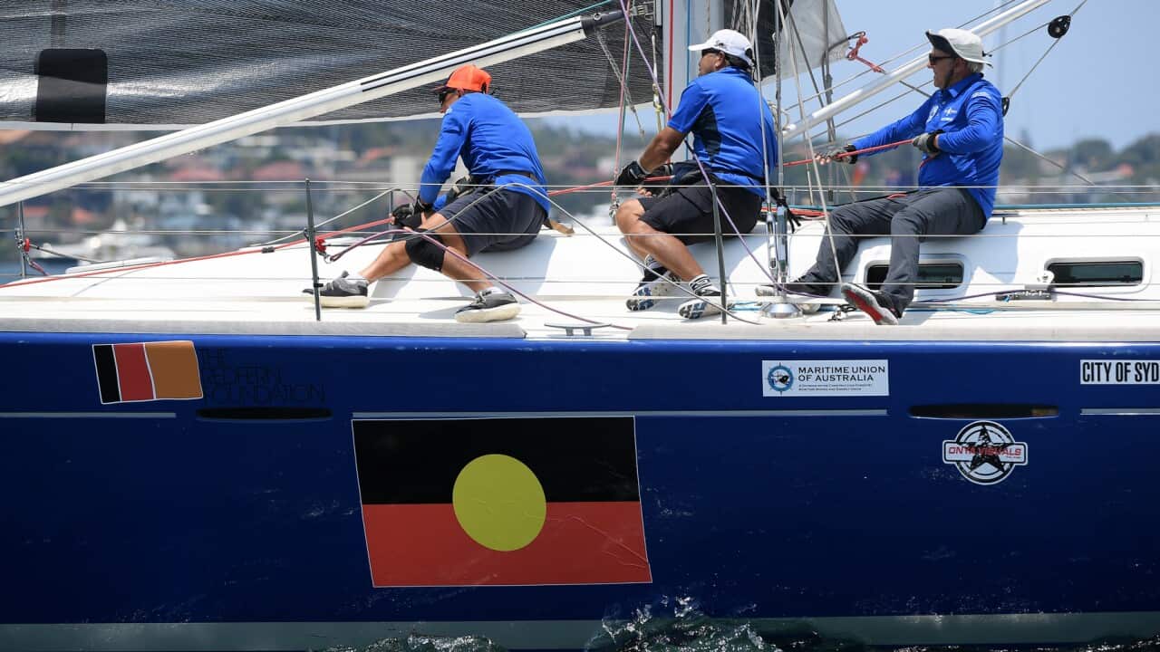 The crew of Tribal Warrior are seen ahead of the start of the Sydney to Hobart Yacht race