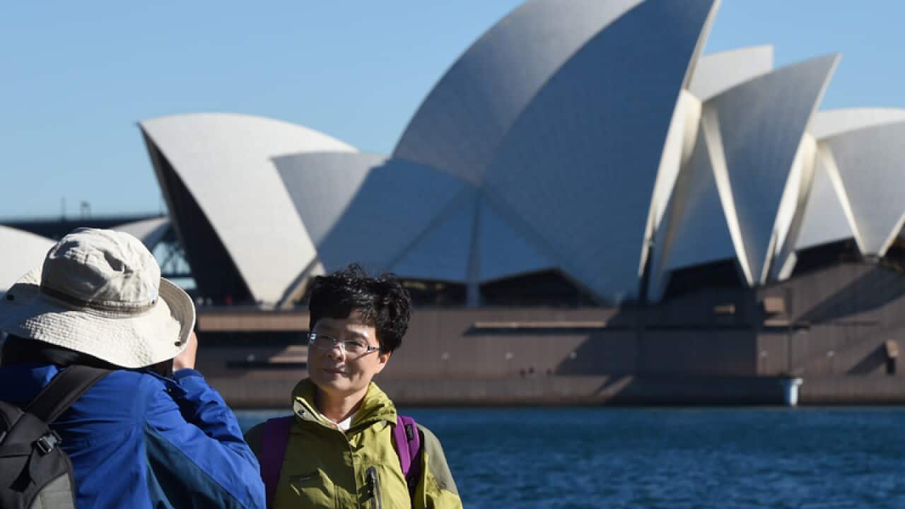 Chinese tourists take in the sites of the Sydney Harbour Bridge