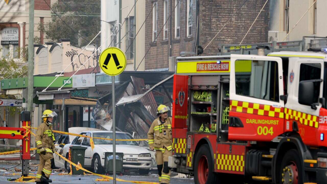 Rescue crews mopping up on Darling Street in Rozelle