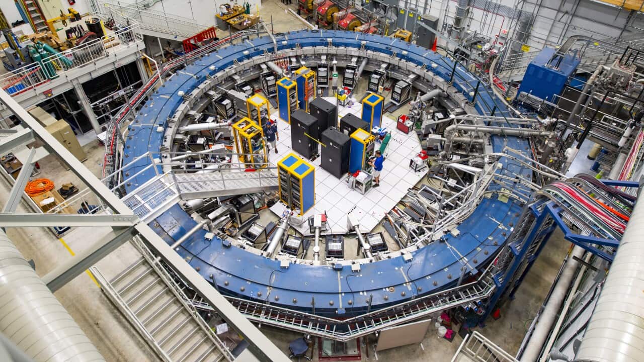 : Fermilab's Muon g2 ring at a lab outside of Chicago. It detects the wobble of muons as they travel through a magnetic field.