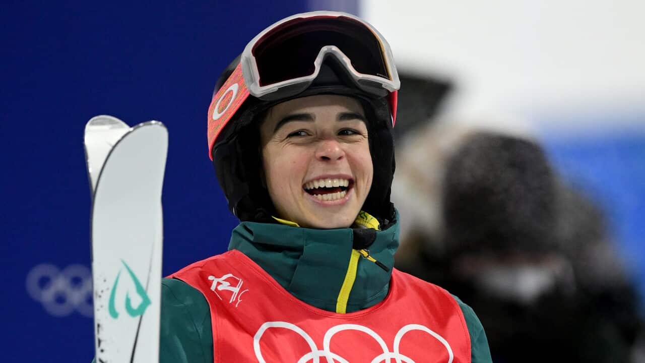 Jakara Anthony celebrates after winning gold in the Womens Freestyle Skiing Moguls Finals round during the 2022 Beijing Winter Olympic Games, 6 February, 2022.