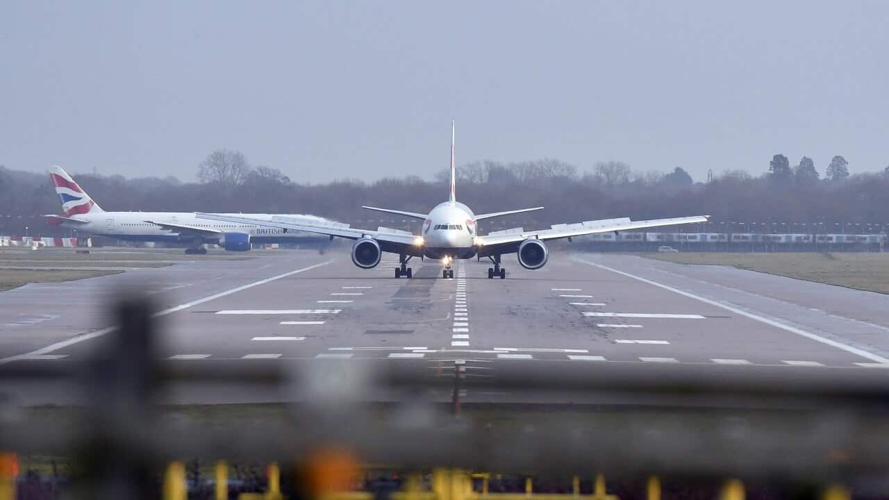A British Airways plane lands at Gatwick airport which had been closed after drones were spotted over the airfield.