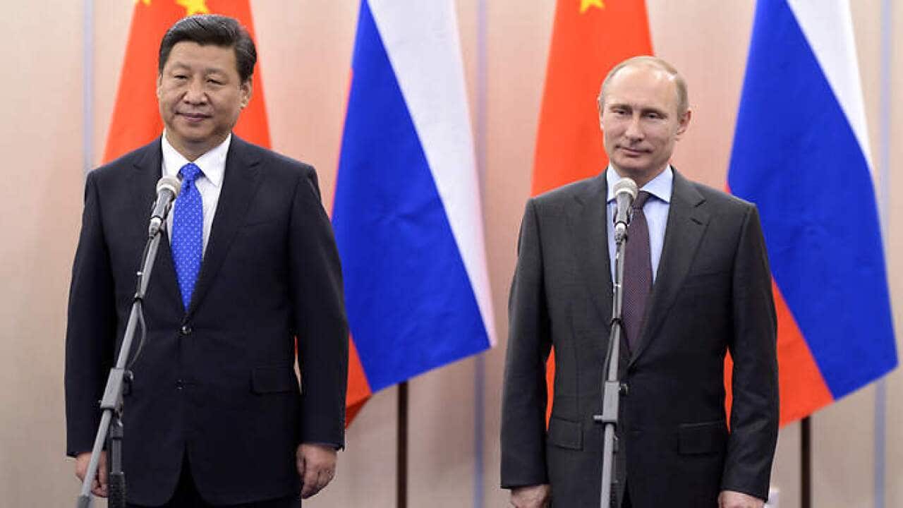 Chinese President Xi Jinping (L) has chosen Russia as his first foreign destination. (AAP)