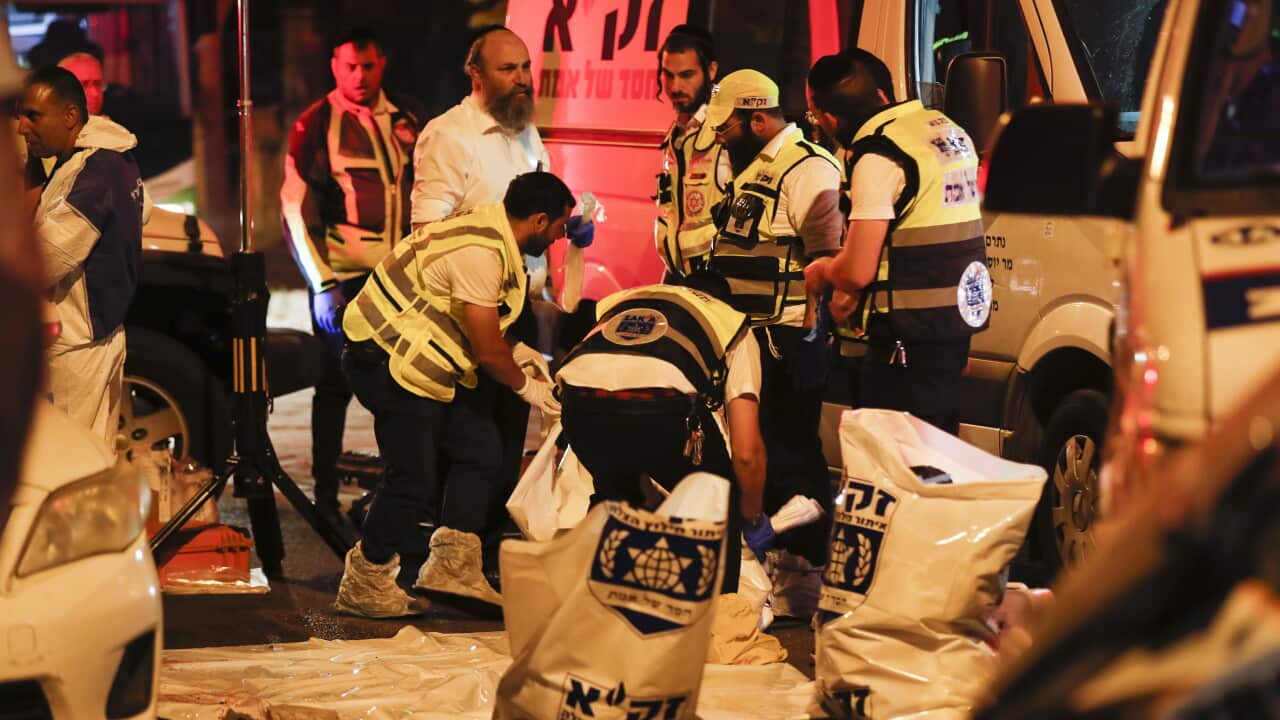 Ambulances and medics at the scene of a stabbing attack.