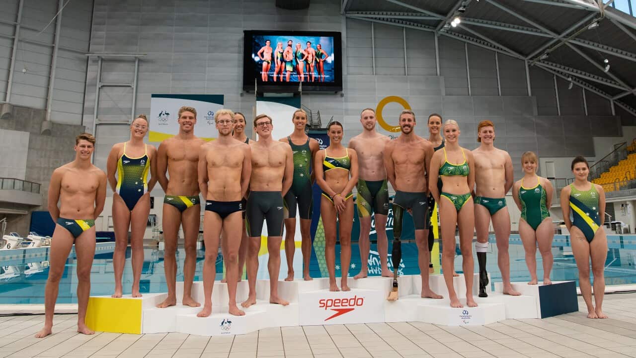 Australian swimmers and divers pose for a photograph during the unveiling of the Olympic and Paralympic swimwear uniform at the Sydney Olympic Park Aquatic Centre in Sydney, Thursday, May 13, 2021. (AAP Image/Bianca De Marchi) NO ARCHIVING