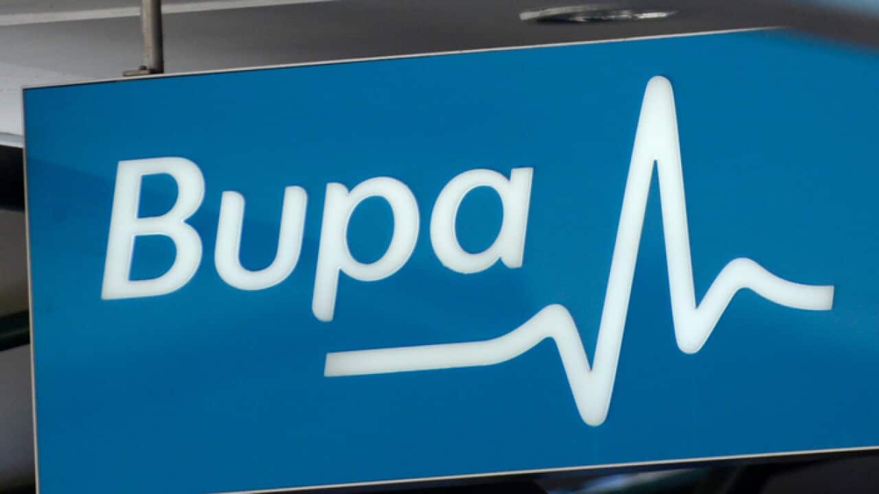 Street signage next to a Bupa private health insurance store in Brisbane