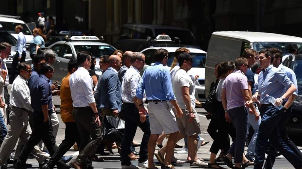 Office workers are seen in the Sydney CBD