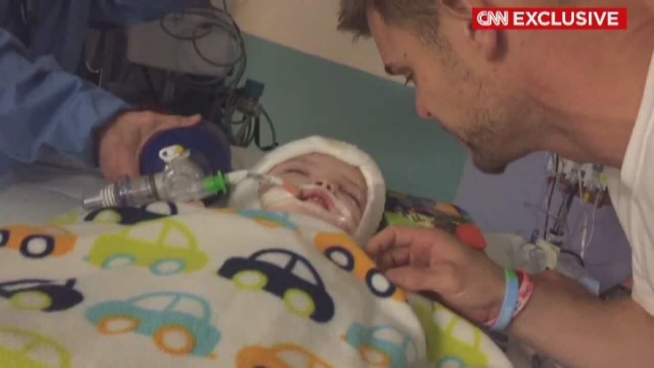 Christian McDonald welcomes his son Jadon out of surgery.