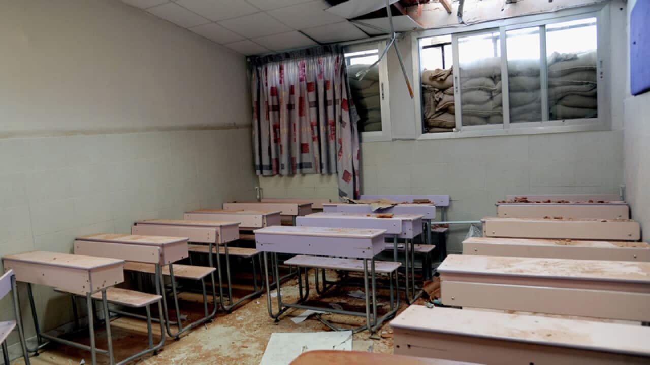 Debris inside a classroom in Damascus