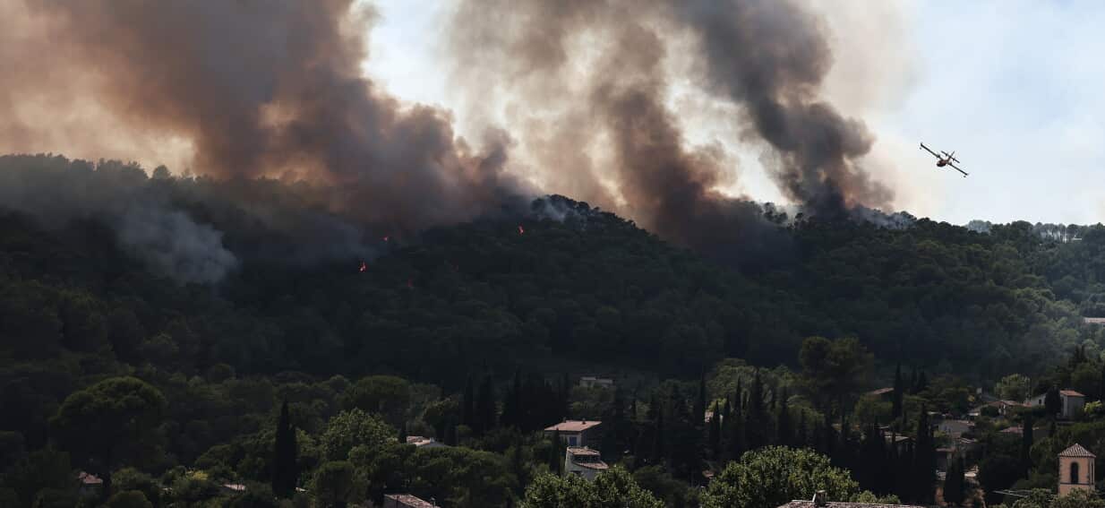 Europe in Flames: Thousands Flee as Wildfires Claim Firefighters Amidst Record Heat