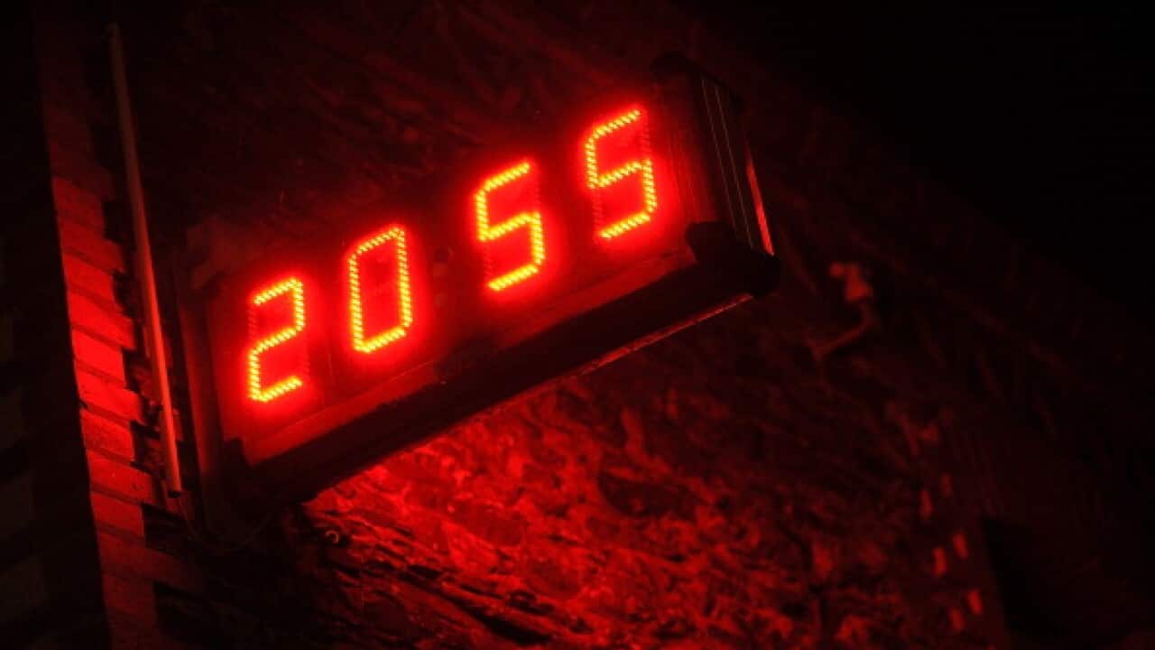 A digital clock is pictured on March 22, 2013, in Angers, western France.