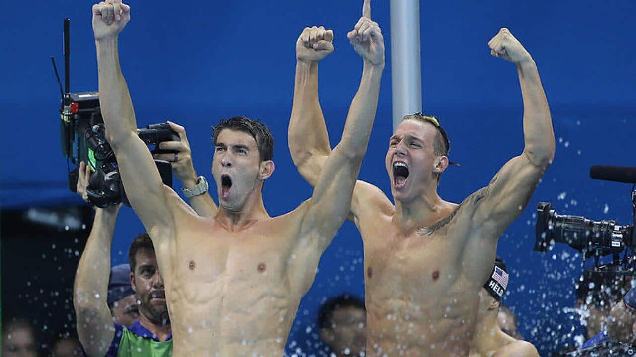 Michael Phelps, (left), of US team celebrate winning the gold medal in the Men's 4 x 100m Freestyle Relay