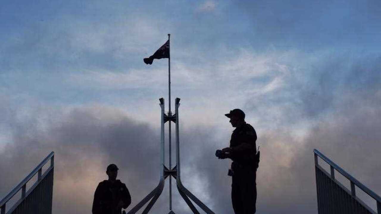 Police seen outside Parliament House Canberra.