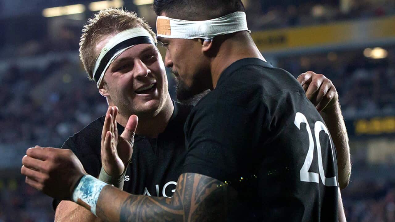 Sam Cane (L) congratulates Vaea Fifita of New Zealand