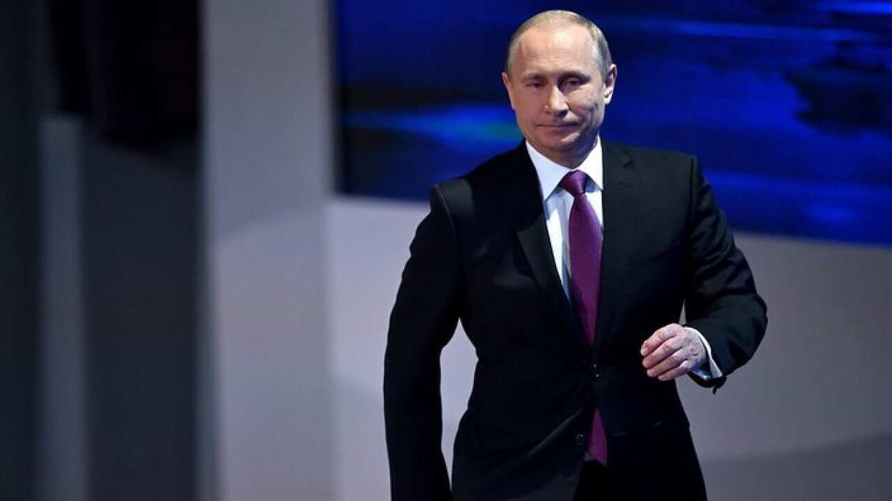 Russian President Vladimir Putin arrives for his annual press conference